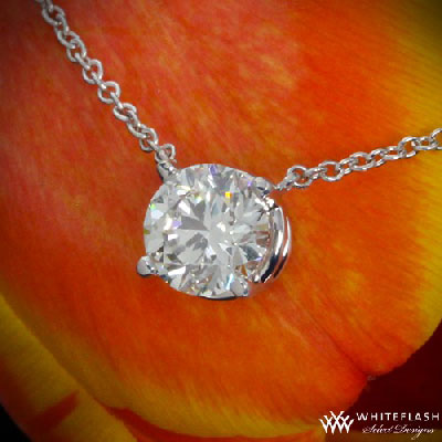 round cut diamond pendant on a flower petal