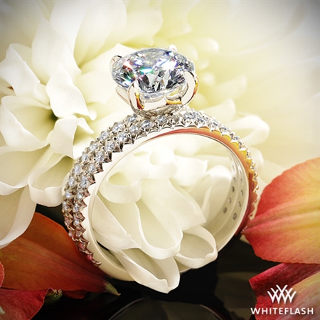 The center diamond is extraordinary and the workmanship in the scalloped design is impressive. 