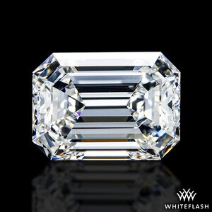 Close-up image of an emerald-cut diamond with high clarity and precision, reflecting light in a step-cut pattern typical of emerald cuts.