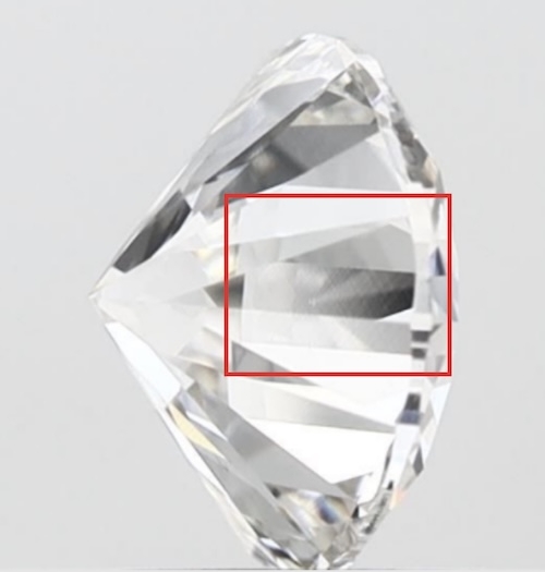 Close-up of a lab-grown diamond showing visible striation lines within the red box. These growth patterns, common in CVD diamonds, can affect transparency and overall appearance.