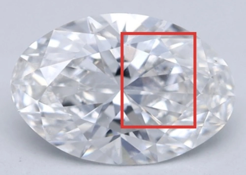 Close-up of an oval-cut diamond highlighting a hazy or milky area within the red box. This effect can indicate reduced transparency, potentially affecting the diamond's brilliance and light performance.